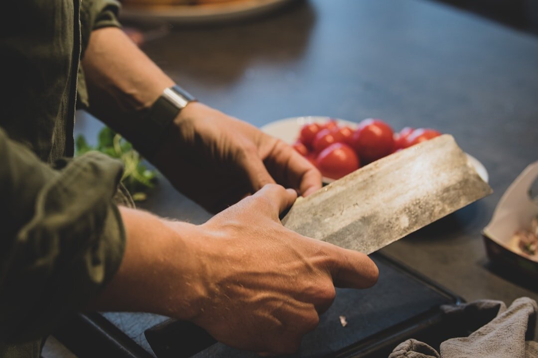 woman chopping fresh vegetables