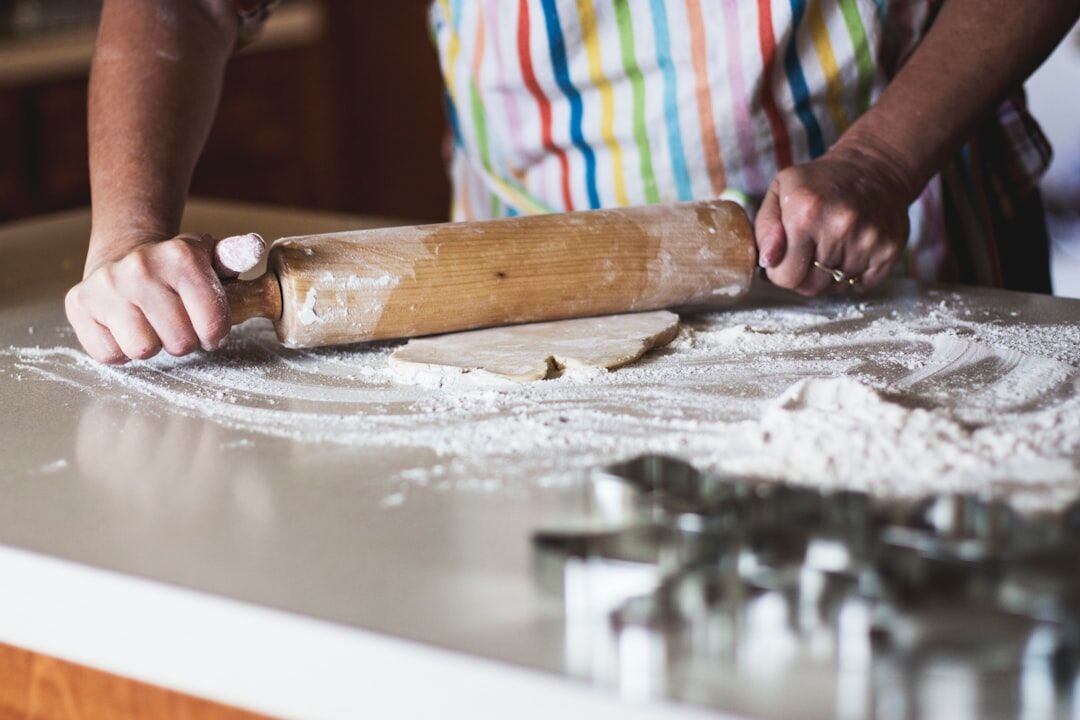 Czech woman kneading dough in a home kitchen